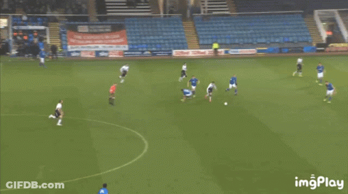 Man Dancing On Soccer Field In Front Of Dubai Sign GIF