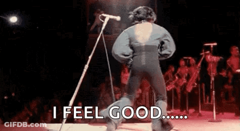 Man Dancing On Stage At Microphone With Crowd GIF
