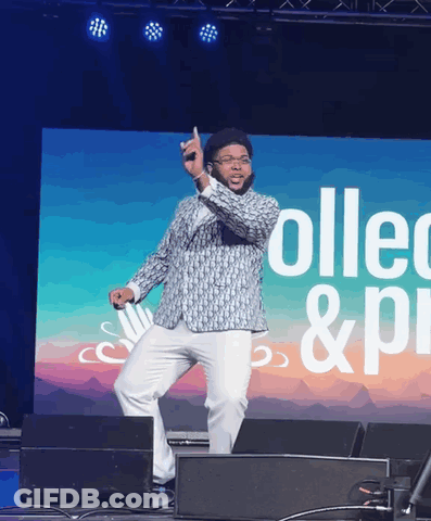 Man Dancing On Stage In Front Of Collect & Pi Screen GIF