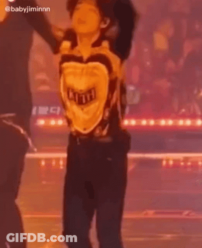 Man Dancing On Stage In Yellow Shirt GIF