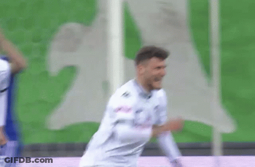 Man Dancing On Stage Near Red Wall GIF