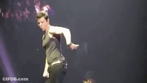 Man Dancing On Stage With Microphone GIF