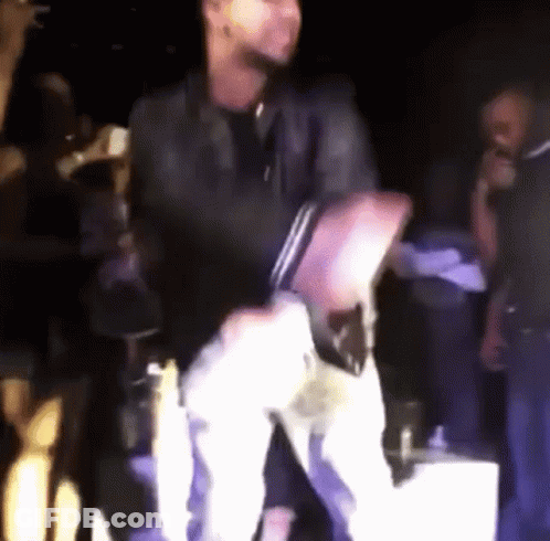 Man Dancing On Stage With Microphone GIF