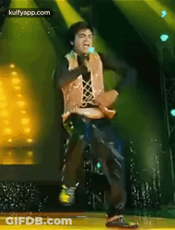 Man Dancing On Stage With Microphone GIF