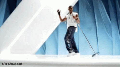 Man Dancing On Stage With Mop GIF