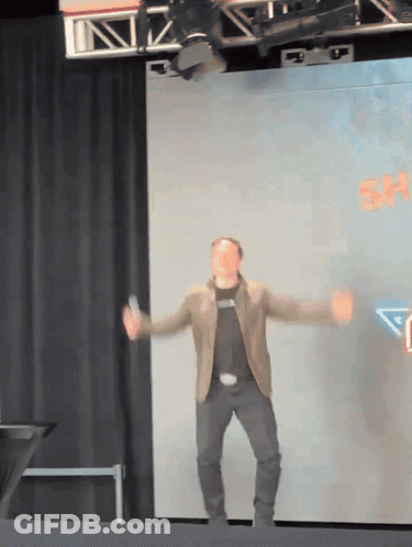 Man Dancing On Stage With Sign Saying Sh GIF