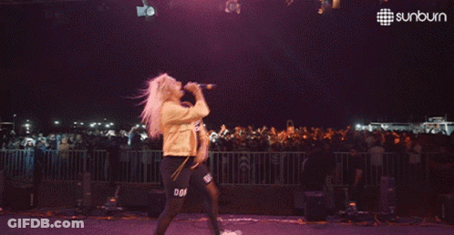 Man Dancing On Stage With Sunburn Logo GIF