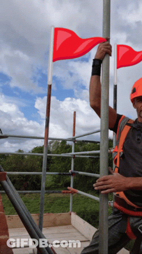 Man Dancing Red Flag Behind GIF