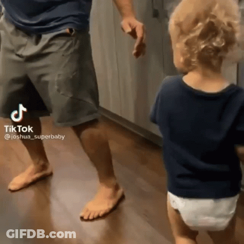 Man Dancing With Baby In Diaper GIF