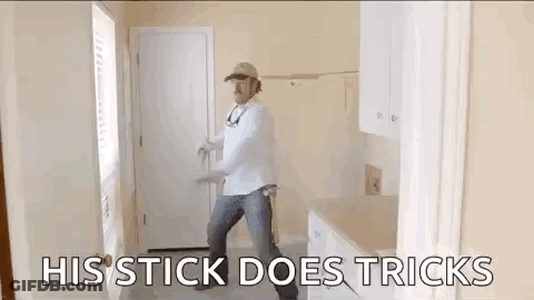 Man Dancing With His Stick Does Tricks GIF
