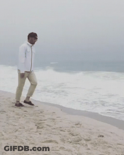 Man Disappears On The Beach GIF