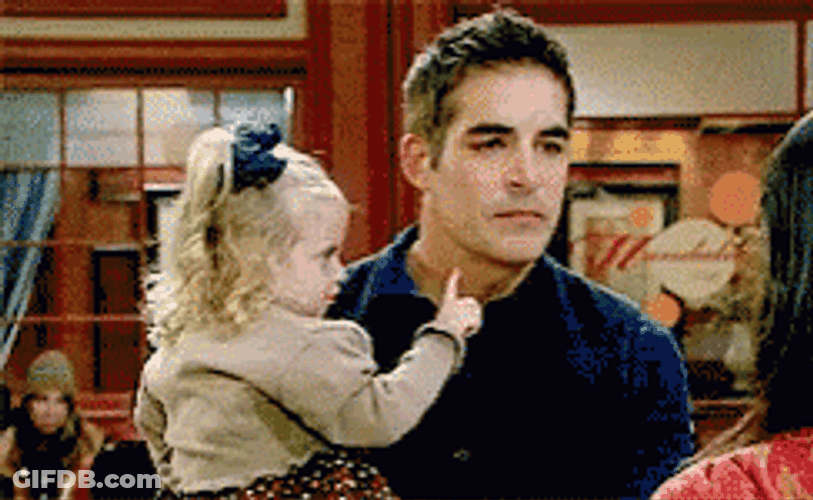 Man Distracted By Baby's Finger GIF