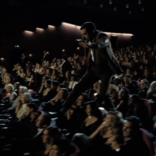 Man Disturb People Watching Nimona Movie GIF