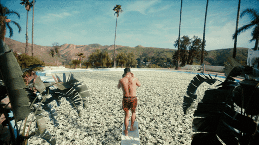 Man Diving Into Money Pool GIF