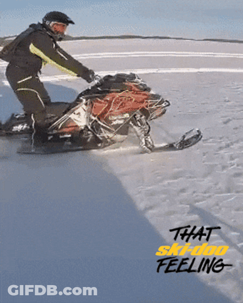 Man Doing A Snowmobile Wheelie GIF