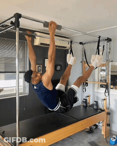 Man Doing Exercises On Pilates Machine GIF
