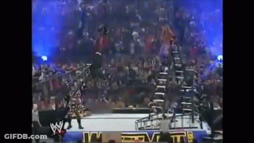 Man Doing Handstand At Wrestling Event GIF