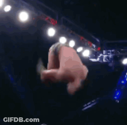 Man Doing Handstand In Dark Room With Lights GIF