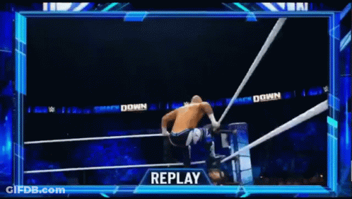 Man Doing Handstand In Wrestling Ring While Another Man Watches GIF