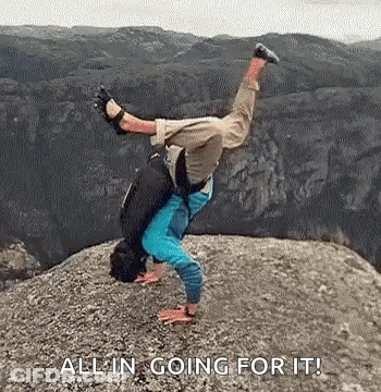 Man Doing Handstand On Rocky Mountain GIF
