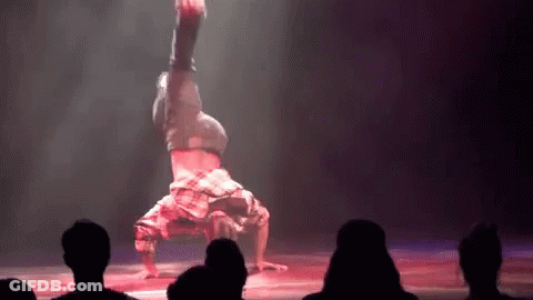 Man Doing Handstand On Stage GIF