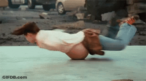 Man Doing Handstand With Car Background GIF