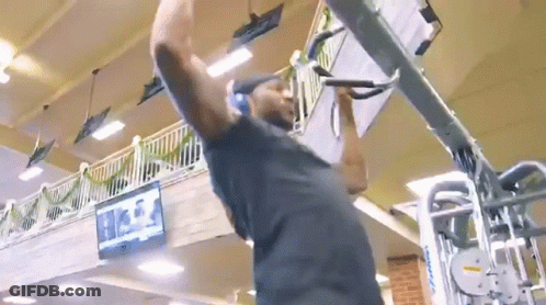 Man Doing Pull Ups In Gym GIF
