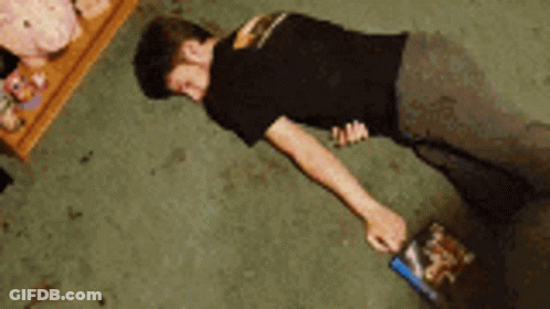 Man Doing Push Ups In Room With Stuffed Animals GIF