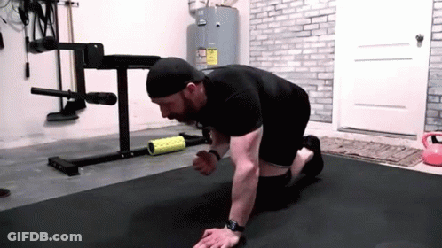 Man Doing Push Ups On Black Mat GIF
