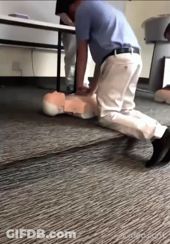 Man Doing Resuscitation On Mannequin GIF