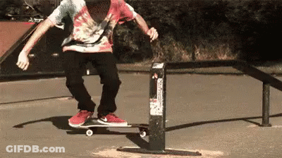 Man Doing Skateboard Trick On Railing GIF