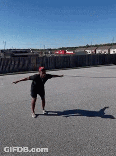 Man Doing Skateboard Trick On Road GIF