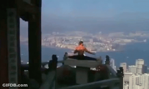 Man Doing Split On Building GIF