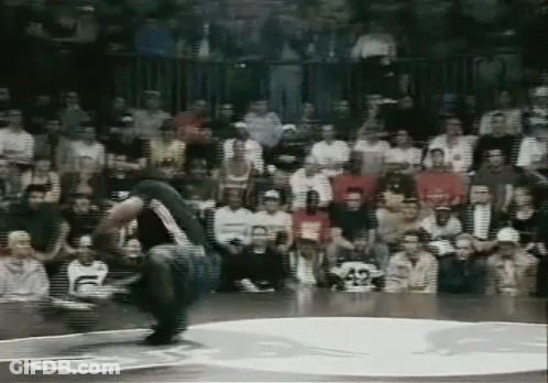 Man Doing Trick On Basketball Court In Front Of Crowd GIF