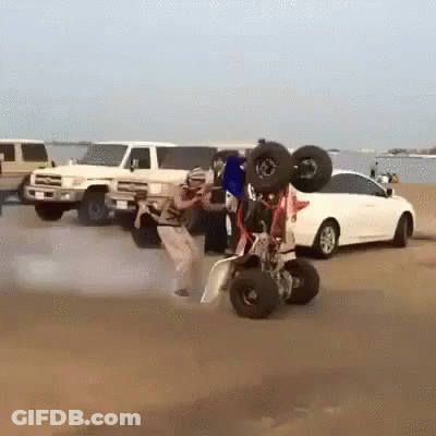 Man Doing Trick On Buggy In Sand GIF