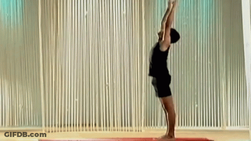 Man Doing Yoga Pose Arms Up GIF