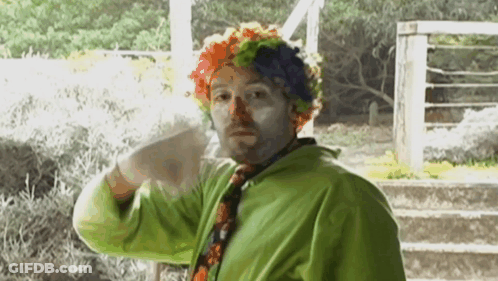 Man Dressed As Clown In Green Jacket GIF