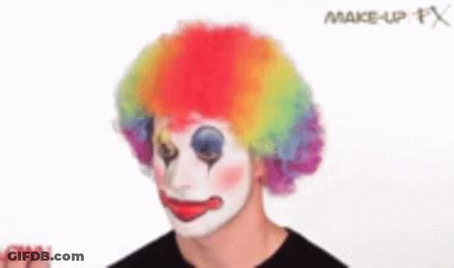 Man Dressed As Clown With Rainbow Wig GIF