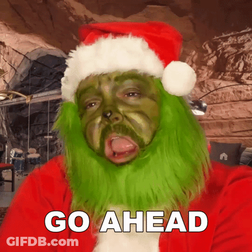 Man Dressed As Grinch Saying Go Ahead GIF