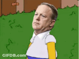 Man Dressed As Homer Simpson Standing In Grass GIF