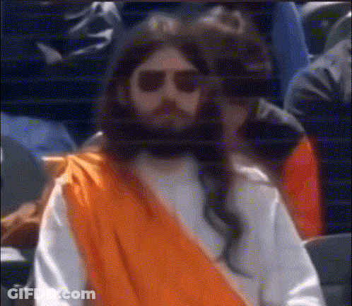 Man Dressed As Jesus In Sunglasses And Orange Robe GIF