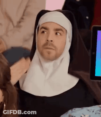 Man Dressed As Nun Sitting At Computer GIF