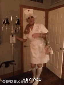 Man Dressed As Nurse Saying Hey GIF