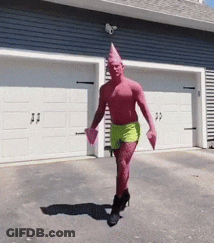 Man Dressed As Patrick Star Walking In Front Of Garage GIF