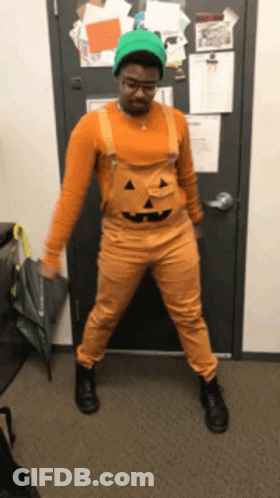 Man Dressed As Pumpkin Holding Umbrella GIF