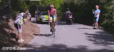 Man Dressed As Roman Soldier In Dark Room GIF