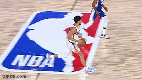 Man Dribbling Basketball In Front Of NBA Logo GIF