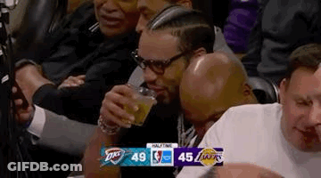 Man Drinking Beer Watching Basketball Game In Stands GIF