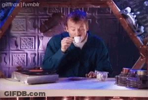 Man Drinking Coffee In Front Of Record Player GIF