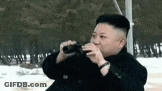 Man Drinking From Bottle In Snow GIF